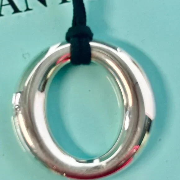 Tiffany & Co. Elsa Peretti Sevillana pre-own silver pendant with silk black cord